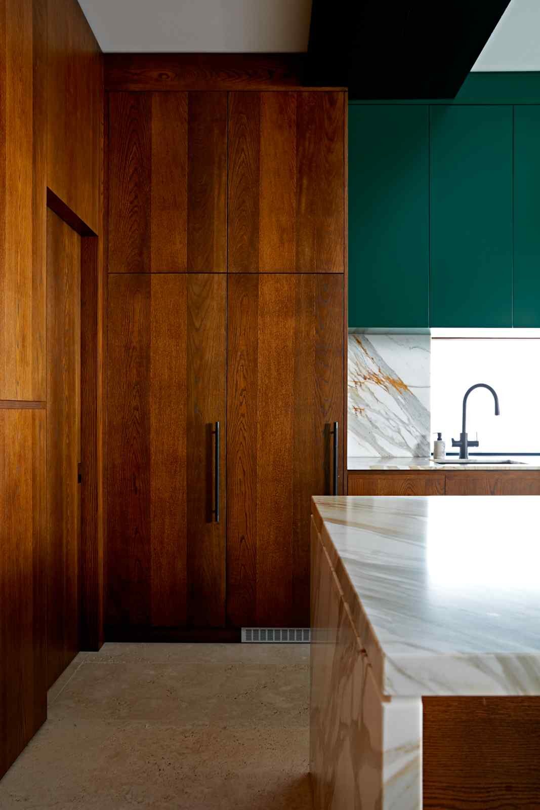 Forest-green Randwick kitchen with dark timber panelling — view 1
