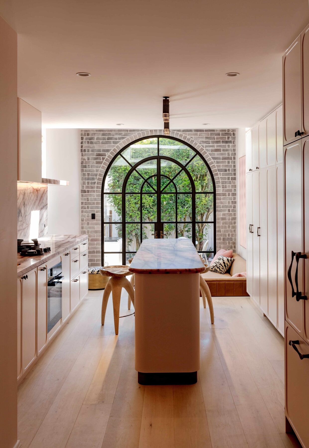 Pale Paddington kitchen with a long stone island — view 1