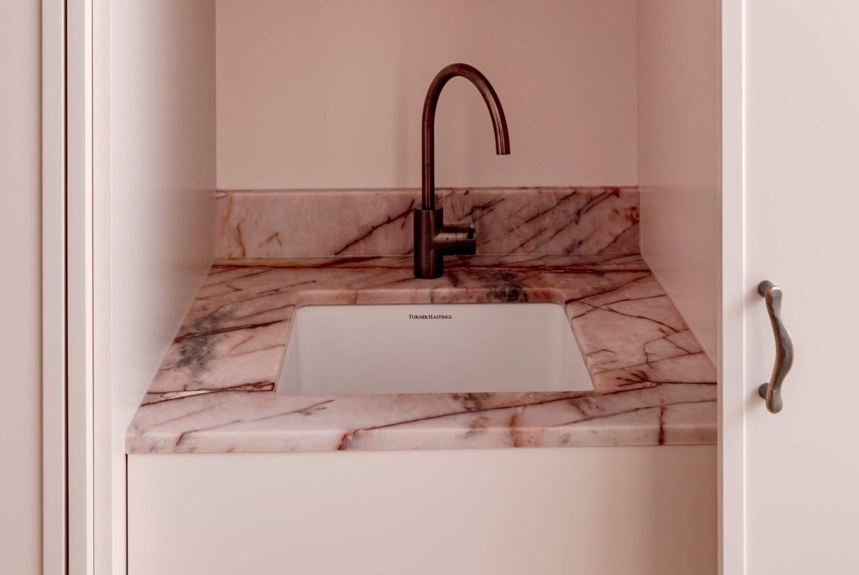 Pale Paddington kitchen with a long stone island — view 6