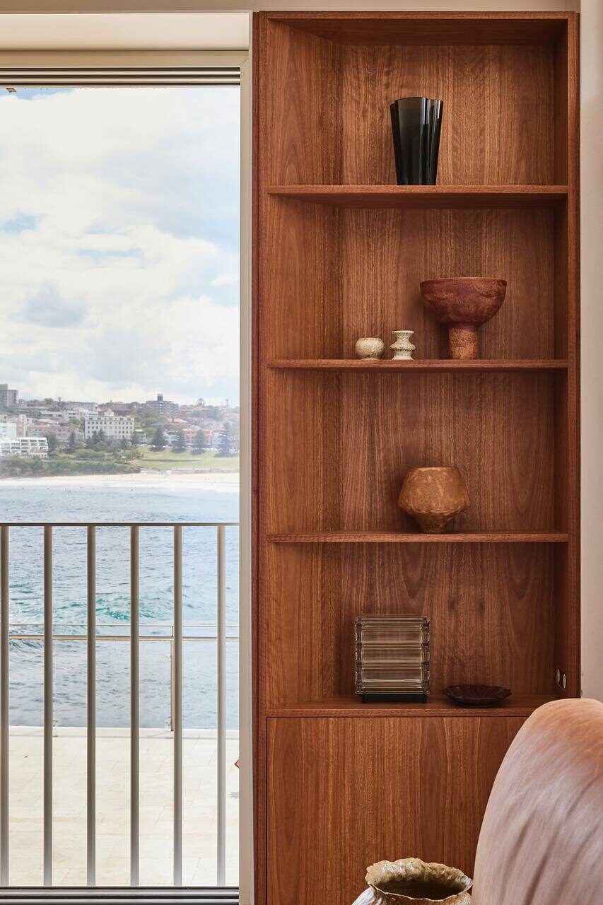 Warm timber kitchen with rust-veined stone — view 4