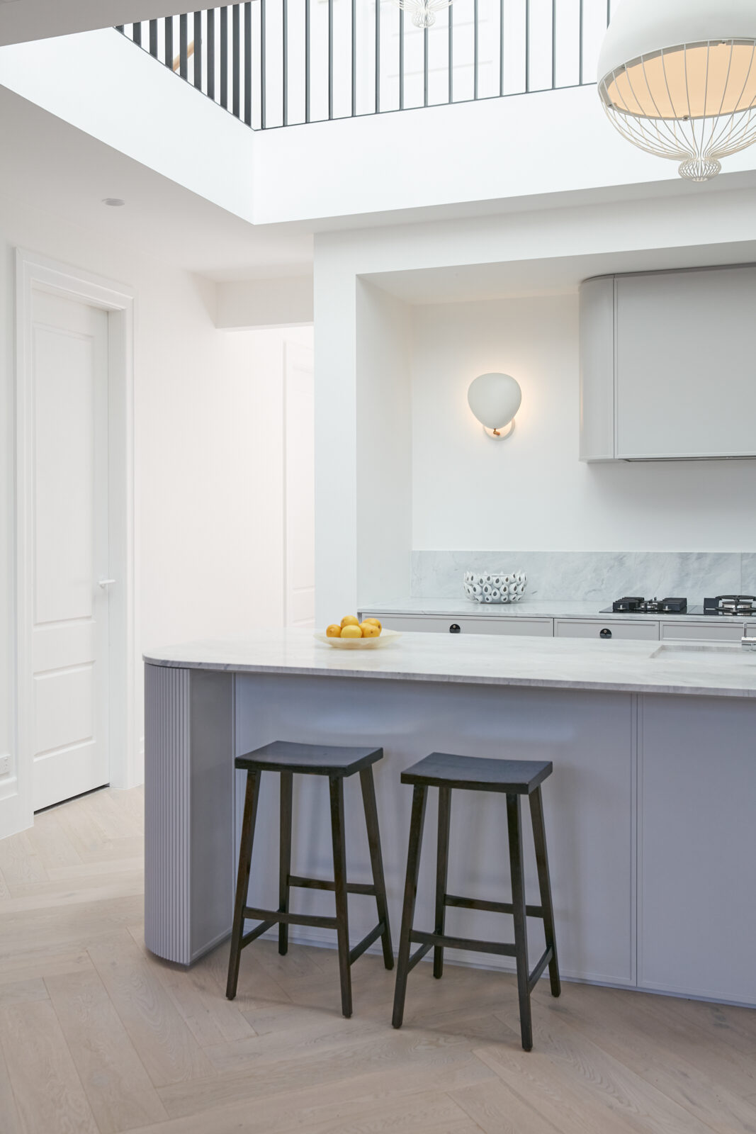 Pale grey Bronte kitchen with a fluted curved island — view 2