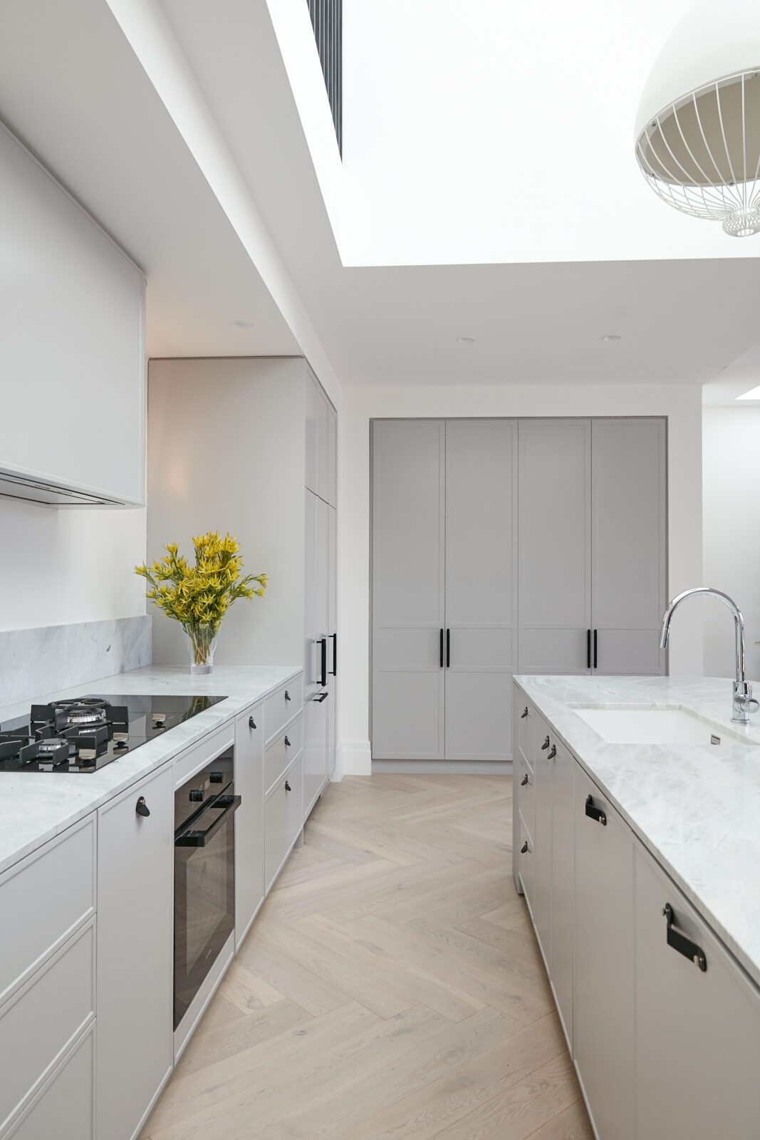 Pale grey Bronte kitchen with a fluted curved island — view 3