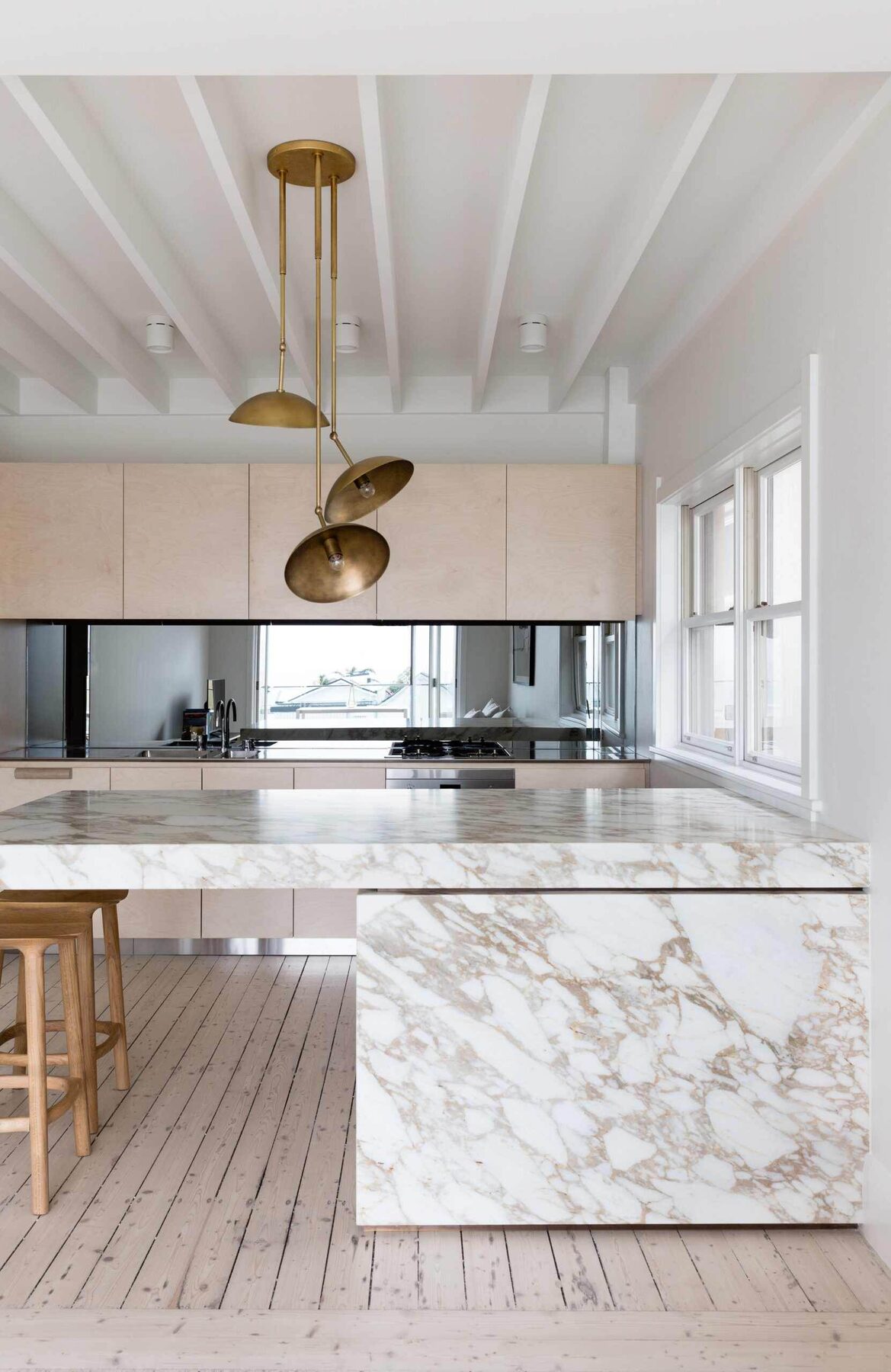 Blonde timber kitchen with marble and brass detailing — view 2