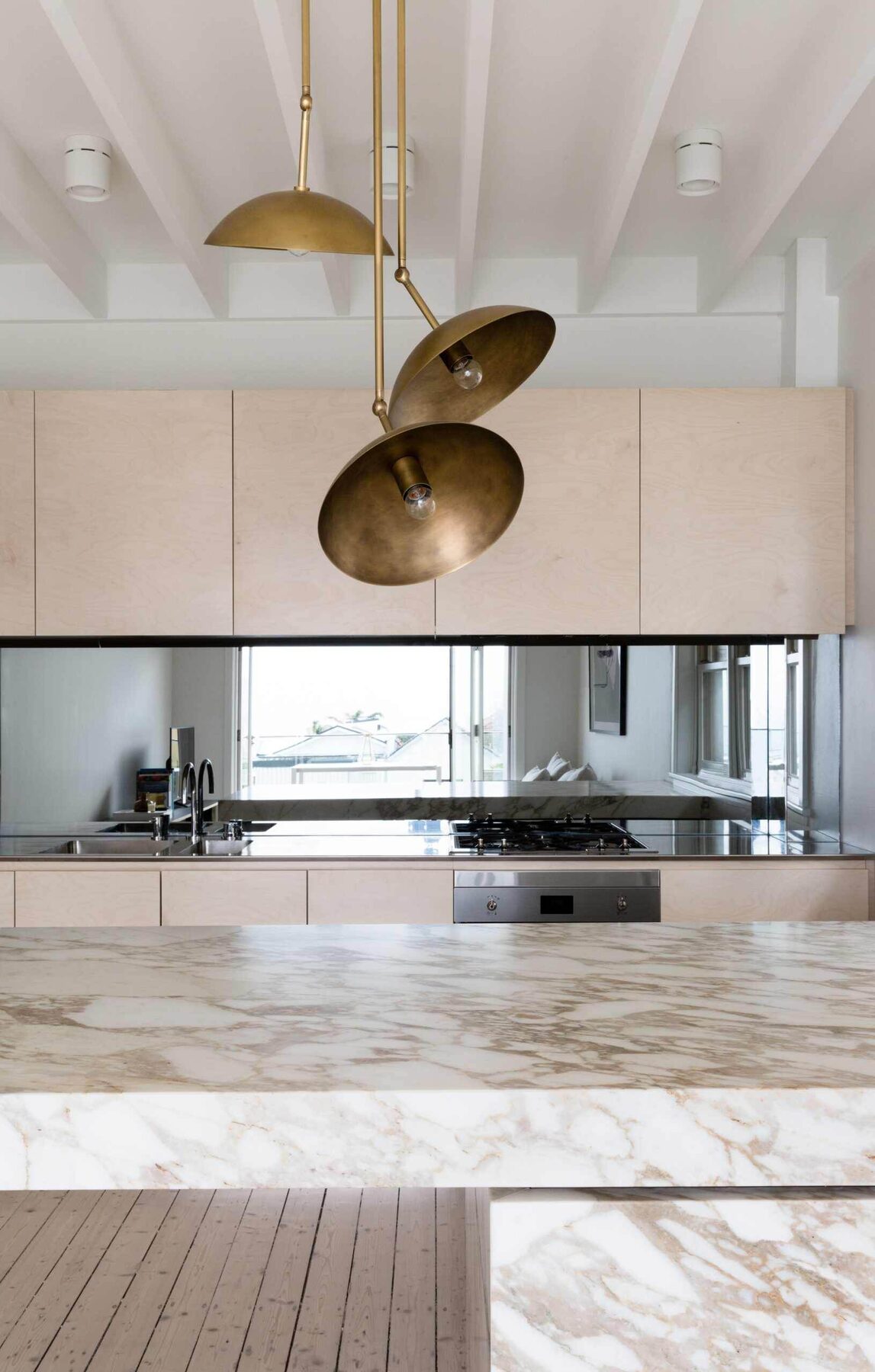 Blonde timber kitchen with marble and brass detailing — view 3