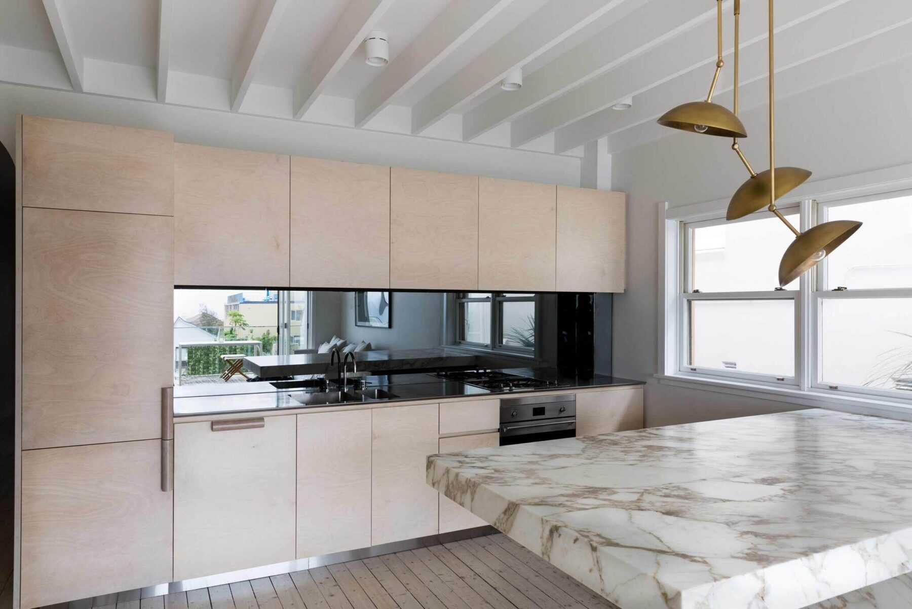 Blonde timber kitchen with marble and brass detailing — view 4